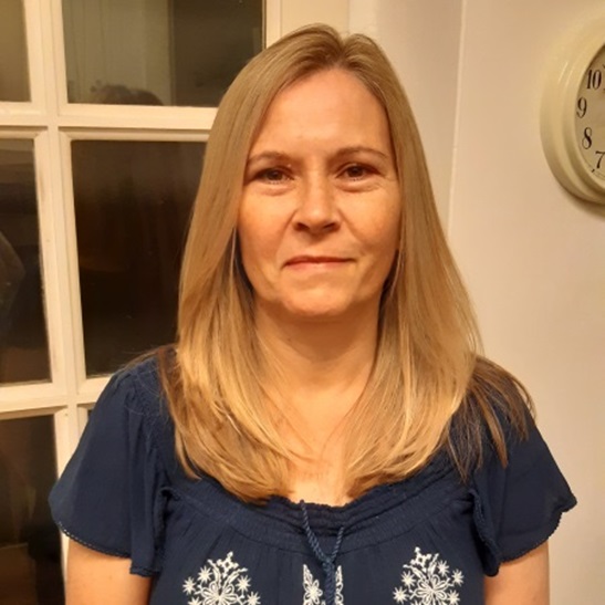 profile pic of Helena Arthur, shoulder length blonder hair in a navy and white blouse